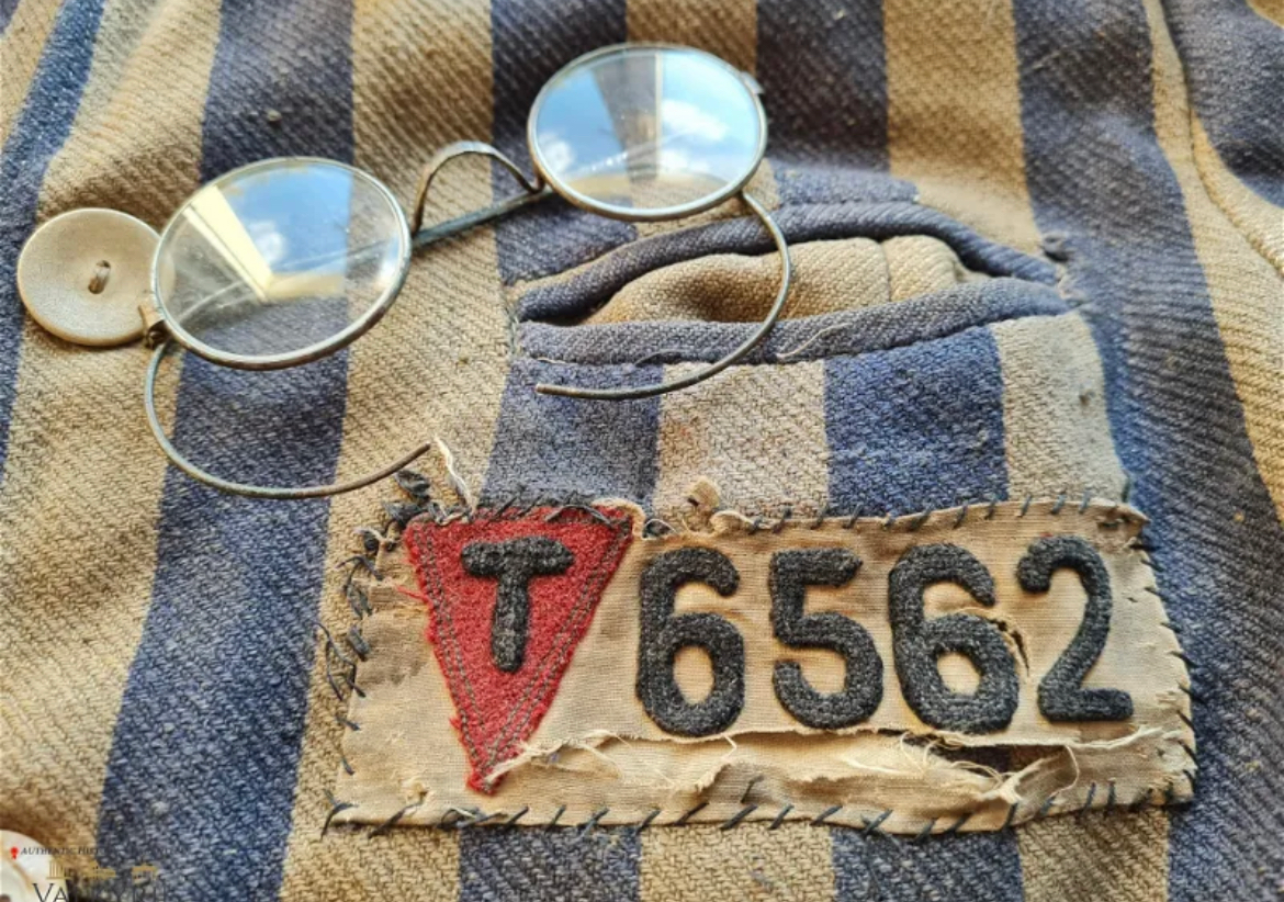 Striped concentration camp prisoner uniform with eyeglasses and prisoner identification patch